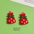 Dettaglio ciondolo sacchetto di Natale in resina rossa con fiocco verde e fiocco di neve - Sacchetto Regalo (W70)