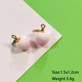 Cute mini peach fruit pendants with pink enamel finish and golden metal hooks - Peach