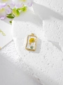 Close-up of a gold rectangular resin pendant with a yellow flower and gold foil flakes - 6 Yellow White Floral