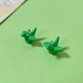 Detail of green resin origami crane charms with silver metal loops for DIY jewelry - Green Paper Crane