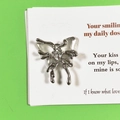 Silver liquid metal butterfly pendant with heart zircon on vibrant green background - Clear