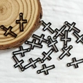 Detailed view of black alloy cross charms with top loop for DIY punk jewelry making - Cross