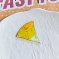 Close-up of acrylic food pendant with yellow texture and hanging hole for DIY jewelry - Triangle Pizza