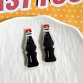 Macro shot of two acrylic miniature cola bottle charms for DIY jewelry and keychain - Bottled Cola