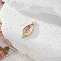 Macro view of teardrop pink dried flower pendant with gold alloy frame for jewelry DIY - Waterdrop Pink Flower
