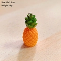 Macro shot of resin pineapple pendant with silver loop, size 3.2x1.3cm and 3.6g weight - Pineapple