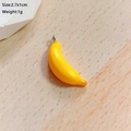Detailed close-up of a 2.7x1cm realistic banana resin pendant for DIY jewelry crafts - Banana