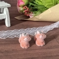 Macro detail of cute orange flocked squirrel animal charms with metal loops for DIY jewelry - Fox
