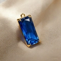 Blue teardrop crystal glass pendant with gold metal frame and four-claw setting design - Blue