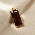 Brown crystal teardrop pendant with gold metal trim and rectangle faceted finish - Brown