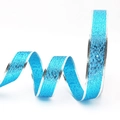 Close-up of bright blue glitter ribbon with silver polka dot edges for gift wrapping - 2.5cm Width Light Blue
