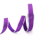 Macro view of purple glitter Christmas ribbon with silver wire edges for gift wrapping - 2.5cm Width Purple