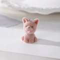 Dettaglio di un ciondolo a forma di cucciolo di Pomerania rosa floccato con anello in metallo - Stile Cane Marrone