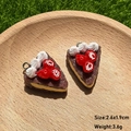 Macro detail of resin chocolate cake charms with size specs 2.6x1.9cm for DIY jewelry - Strawberry Cake