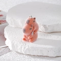 Felted capybara charm with metal ring for DIY jewelry making on stone display - Stacked Sitting Style