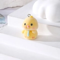 Close-up of a flocked yellow duck pendant with a blue tie and metal ring for DIY jewelry - Yellow Duck With Tie