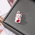 Detail of white alloy lucky cat charm with red collar and lucky coin for DIY jewelry - Red Million Coin