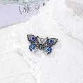 Dettaglio del ciondolo a farfalla in argento vintage con motivi a occhio blu per gioielli DIY - Farfalla Argento Vintage (F)