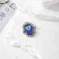 Dettaglio della Mano di Fatima con occhio a cuore blu e strass in cristallo dorato - Cuore Malocchio Oro (G)