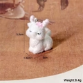 Macro shot of flocked white animal pendant with dimensions 3.5x3cm and 8.4g weight - Lying Deer Style