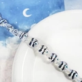 Dettaglio di perline in acrilico a forma di caramella con motivo evil eye e strisce - Stile pesce involucro di caramelle (D)