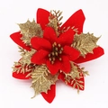 Detailed view of red velvet petals and golden glitter layers on a Christmas poinsettia decoration - 13cm Gold Red
