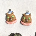 Detail of cute resin capybara charms with spa theme for DIY earring and keychain making - Sleeping Cap Style