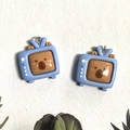 Detail of blue TV-shaped resin pendants with cute brown bear motifs for DIY jewelry - Television Style