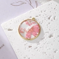 Handmade alloy flower pendant with pink dried petals in resin on stone base - Pink