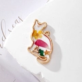 Detailed close-up of handmade cat resin pendant with dried flowers and gold metal frame - Sitting Yellow Red Cat