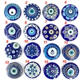 Detailed grid of sixteen assorted blue evil eye glass charms for DIY jewelry making - Style 10