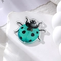 Detail of tiffany blue acrylic ladybug pendant with black spots and glitter for DIY jewelry - Blue Ladybug