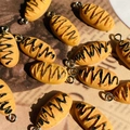 DIY bread charms with chocolate stripes for jewelry making on vintage background - Bread Style (D204)