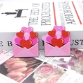 Detail of wooden Valentine heart envelope pendants with red and pink layered print - Heart Envelope Style (19)