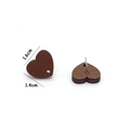 Macro detail of heart-shaped wooden stud earrings with wood grain and size dimensions - Heart Shape