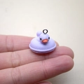 Macro shot of a purple resin duck charm held in hand for size and detail scale - W20 / Purple Duck
