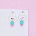 Close-up of cute white resin rabbit charms with mint green overalls for DIY jewelry - Blue Clothes White Rabbit