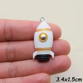 Detail of resin rocket charm 3.4x1.5cm with gold accents and metal ring for DIY jewelry - Rocket