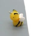 Detail of a cute yellow resin bee pendant with white wings and silver metal ring - Bee Style (F150)