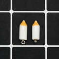 Detail of two resin crayon pendants with silver metal rings for DIY jewelry making - White Crayon