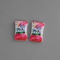 Macro view of pink miniature potato chip charms with silver rings for DIY jewelry making - Korean Pink White