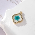 Alloy gold-edged pendant with transparent resin, real blue dried flower and gold foil flakes - Blue Floral