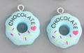 Light blue resin donut pendant with chocolate lettering and heart pattern for DIY crafts - Blue Donut