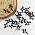 Macro shot of black plated alloy star pendants for DIY jewelry making accessories - Shooting Star