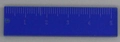 Close-up of a blue acrylic ruler charm with white scale markings and a hanging hole - Ruler / Deep Blue Straight Ruler