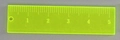 Detail view of a fluorescent yellow acrylic ruler pendant with scale and hanging hole - Ruler / Fluorescent Yellow Straight Ruler