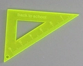 Macro detail of acrylic triangle ruler pendant with Back to School print for DIY jewelry - Yellow Triangle Ruler