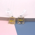 Creative resin earrings featuring yellow goldfish in transparent water bag design - Golden Fish