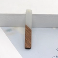 Minimalist long strip pendant featuring a cream resin and dark wood splice design - Grey Rectangle