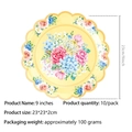Detail eines gelben 9-Zoll-Papptellers mit Blumenmuster und gewelltem Rand für Partys - Gelb Gezackter 9 Zoll Papierteller